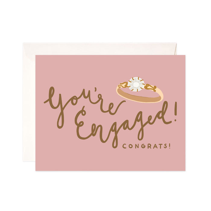 Engaged Ring - Bloomwolf Studio Card That Says You're Engaged! Congrats!, Pink Background, Gold Print, Diamond Ring